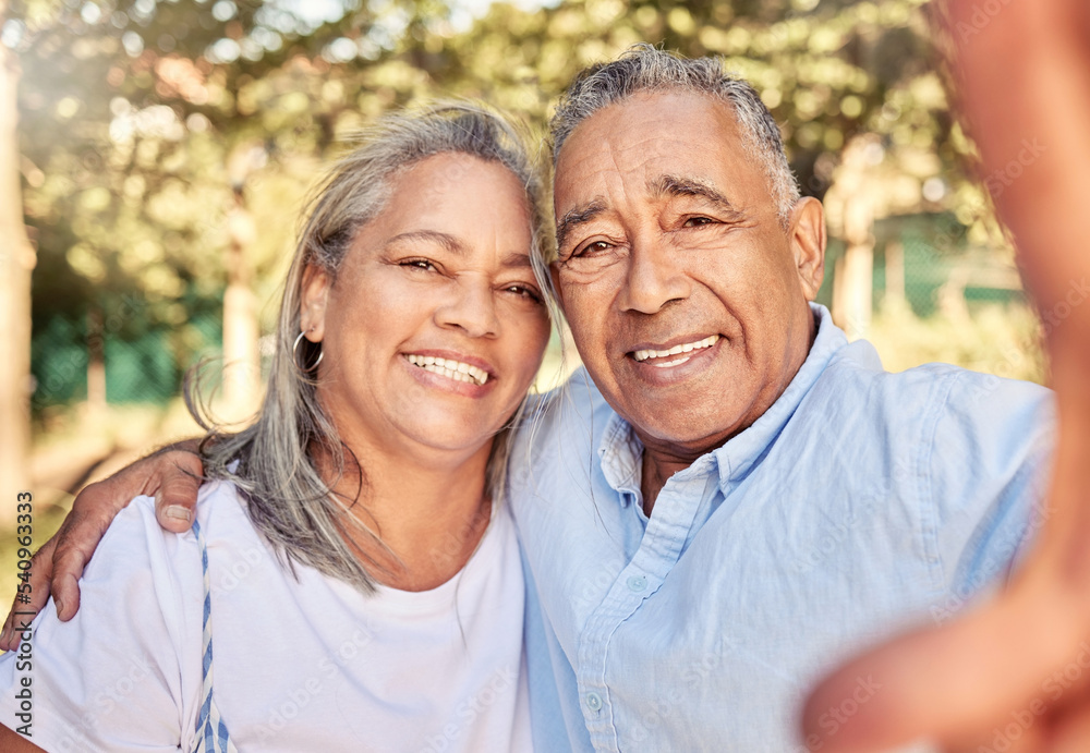 Selfie, portrait and senior couple in a park for love, care and happiness during retirement together. Happy, smile and elderly man and woman with a photo in nature, garden or environment in summer