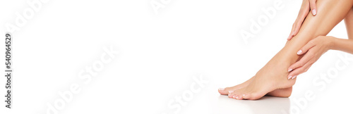 Fototapeta Naklejka Na Ścianę i Meble -  Perfect depilated woman legs on white background.