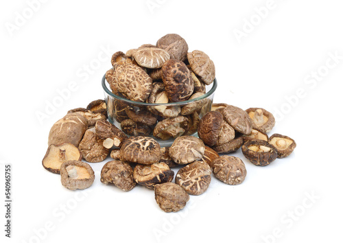 Mushrooms dry in glass bowl on white background