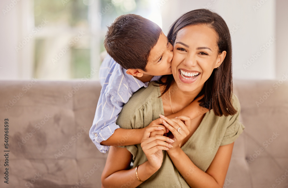 Kiss, mother and child with hug for love, care and gratitude on mothers day on the sofa of the living room in their house. Portrait of a happy, young and mom with a smile for affection from her kid Kiss, mother and child with hug for love, care and gratitude on mothers day on the sofa of the living room in their house. Portrait of a happy, young and mom with a smile for affection from her kid