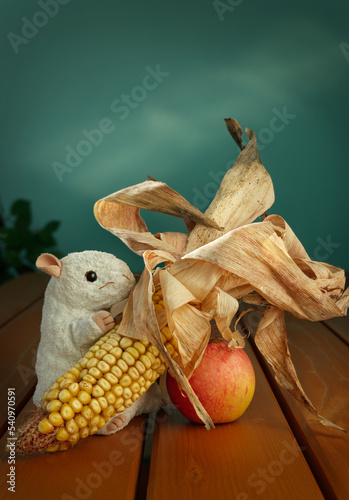 Fototapeta Naklejka Na Ścianę i Meble -  Toy mouse Corncob Apple on table