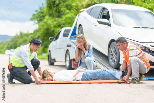 An injured woman in a plastic stretcher after a car accident ,Car accident insurance concept