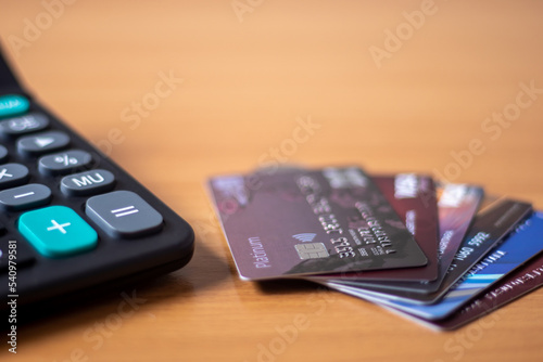 Three credit cards put a spoon on the table.