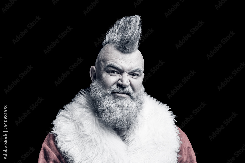 Evil aggressive grayhaired old man Santa in a bad mood. Severe dangerous Santa Claus with