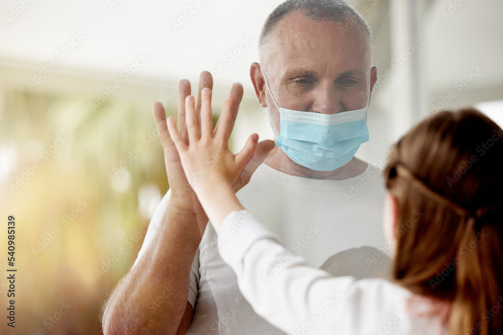 Covid, window and lockdown father with child for family hand touch with social distance protocol. Love, daughter and dad with quarantine mask protection at glass for communication with young kid.