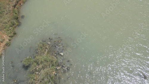 Tilt up from Bushman's River to reveal water spraying from Wagendrift Dam Wall outlet photo