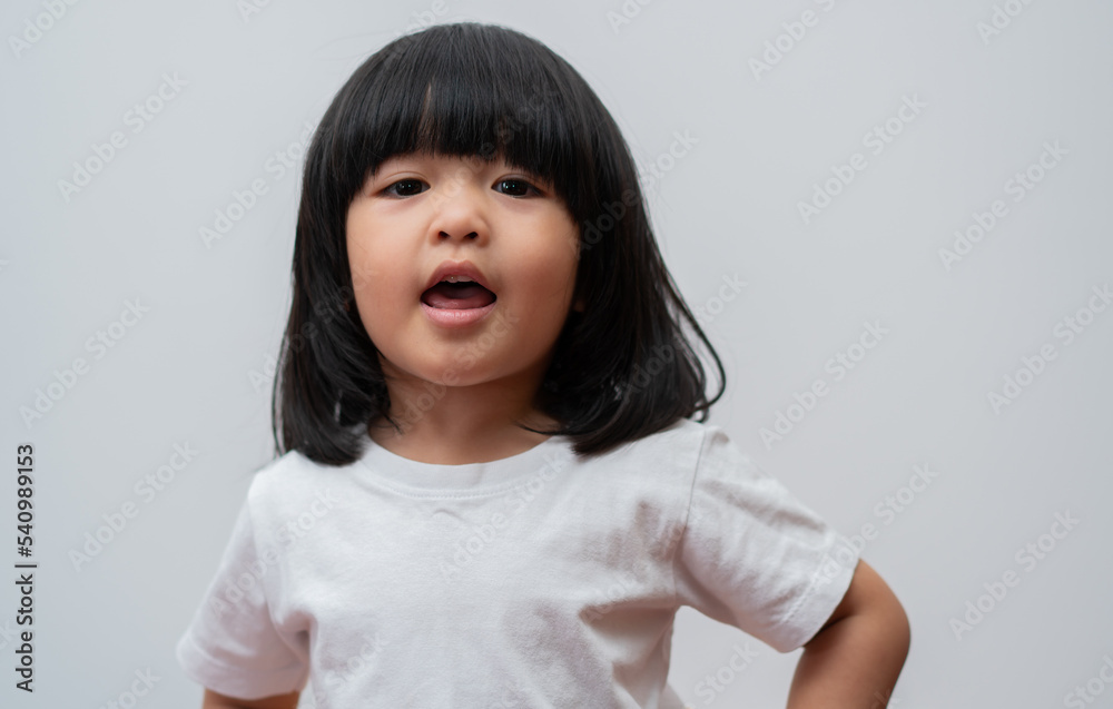 Portrait of happy and funny Asian child girl on white background, a child looking at camera hand gesture. Preschool kid dreaming fill with energy feeling healthy and good concept Portrait of happy and funny Asian child girl on white background, a child looking at camera hand gesture. Preschool kid dreaming fill with energy feeling healthy and good concept
