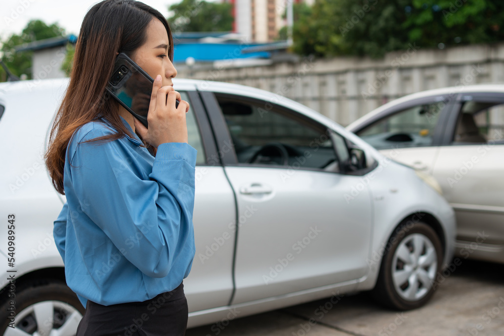 Woman drivers call insurance after a car accident before taking pictures and sending insurance. Online car accident insurance claim idea after submitting photos and evidence to an insurance company. Woman drivers call insurance after a car accident before taking pictures and sending insurance. Online car accident insurance claim idea after submitting photos and evidence to an insurance company.
