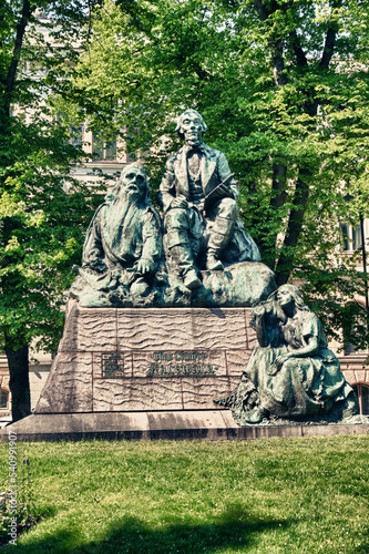 Helsinki, Finland, February 2018 - A group of people sitting on a bench in a park
