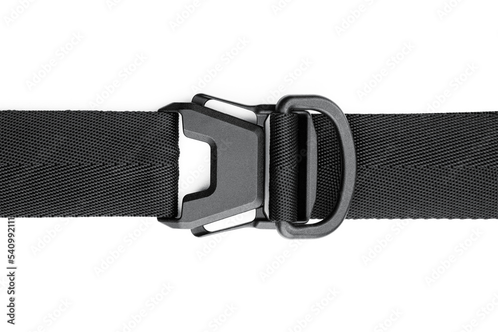 Black plastic fastener fastex for the manufacture of backpacks. Plastic belt clip, carbine - buckle, length adjusters on bag or backpack strap. Fastex buckle on textile belt on white background. Black plastic fastener fastex for the manufacture of backpacks. Plastic belt clip, carbine - buckle, length adjusters on bag or backpack strap. Fastex buckle on textile belt on white background.