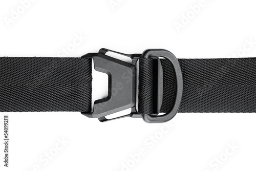 Black plastic fastener fastex for the manufacture of backpacks. Plastic belt clip, carbine - buckle, length adjusters on bag or backpack strap. Fastex buckle on textile belt on white background.