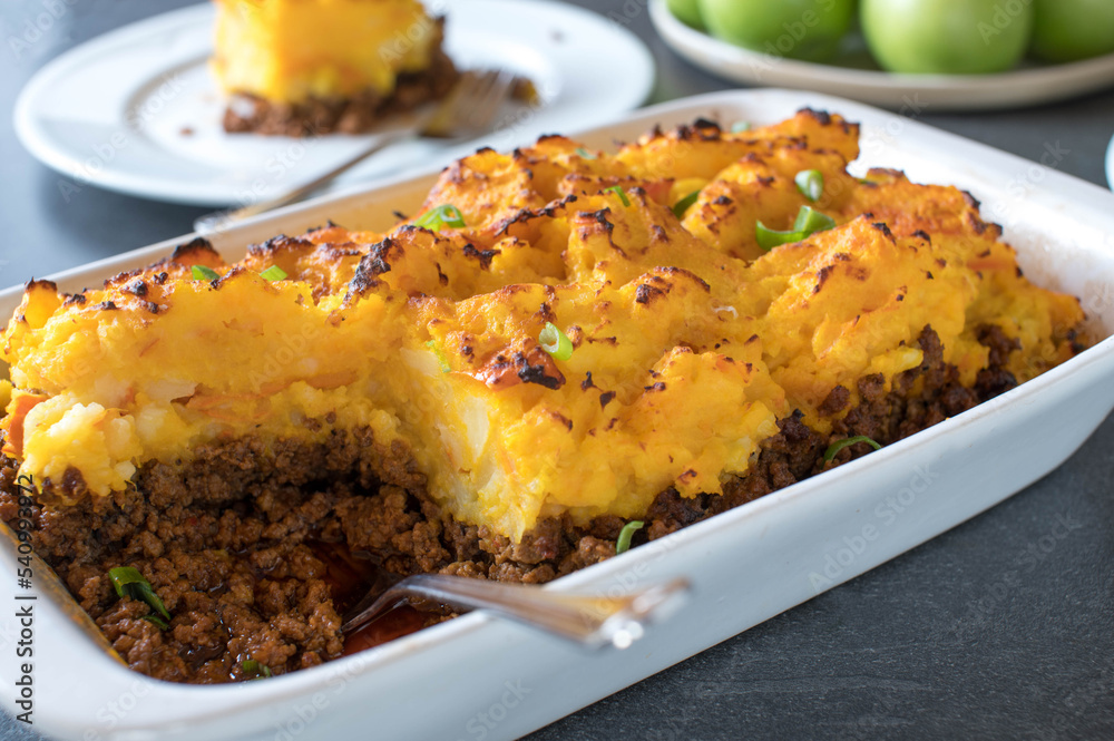 Ground beef pumpkin, potato casserole on a dinner table