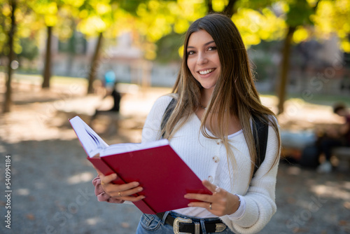 Female college student reading a book