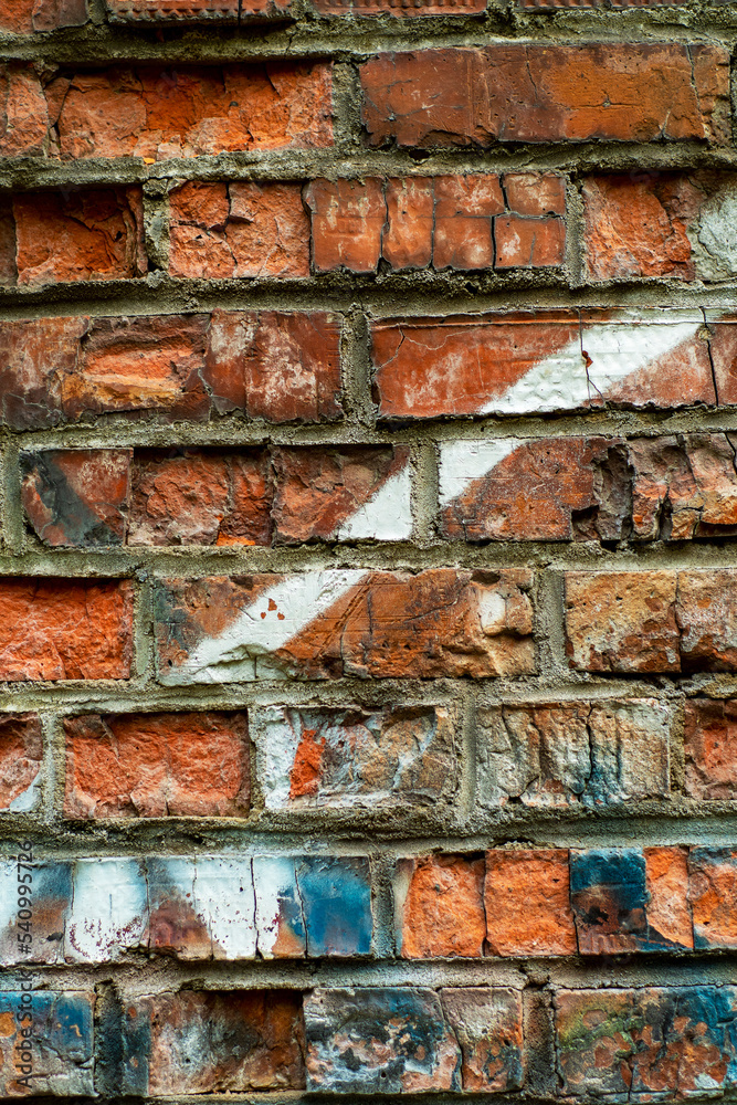 Background with part of a painted brick wall. Abstract bright template for a cover on an informal and youth theme. Background with part of a painted brick wall. Abstract bright template for a cover on an informal and youth theme.