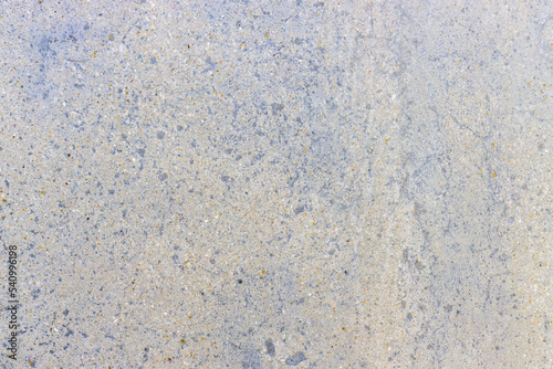 close up texture of smooth blue and yellow stone wall