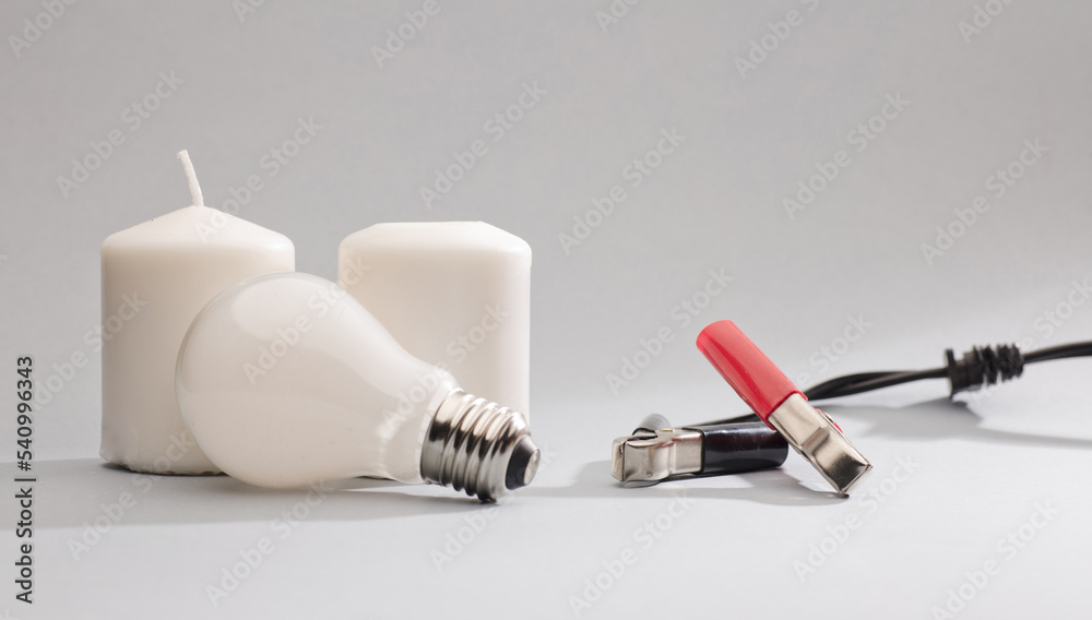 positive red bolts, negative black, with light bulb off and candles gray background
