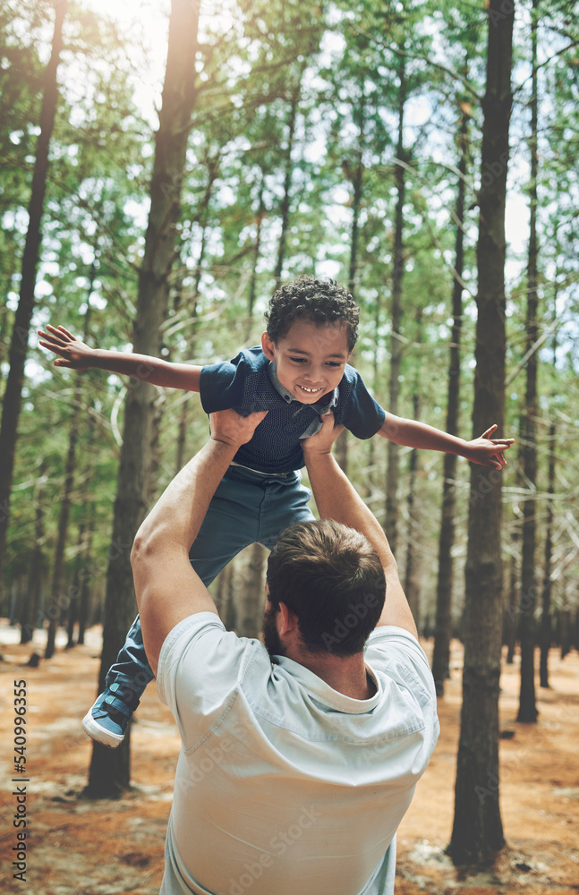 Forest, adoption and love of father lifting son to play airplane wings or flying in air game. Foster, interracial and family with happy black kid bonding with caucasian dad in Canada nature.
