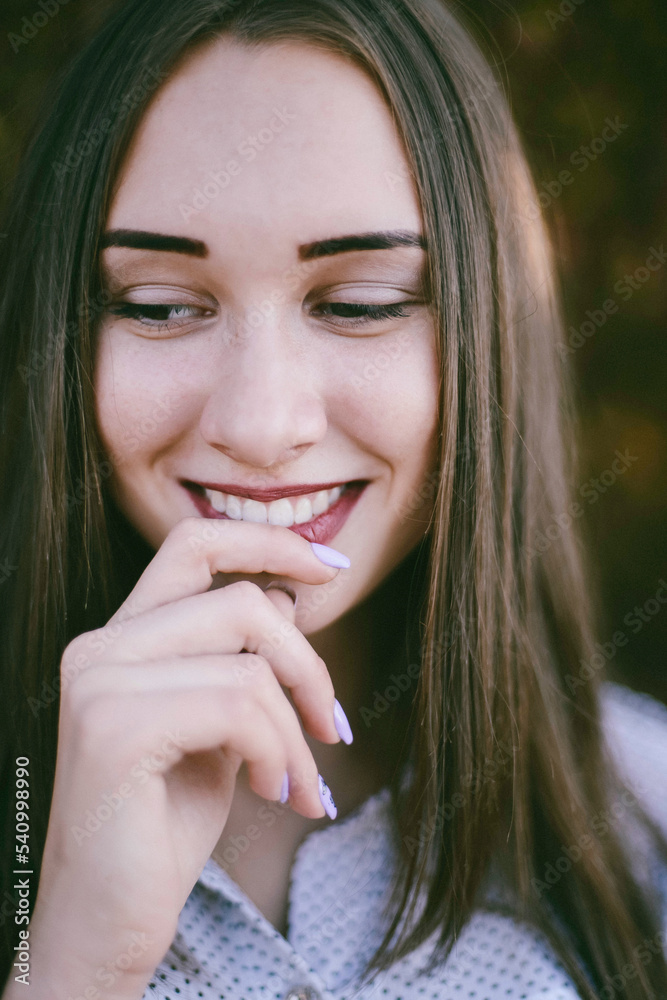 Close-up of smiling woman looking down at park Close-up of smiling woman looking down at park