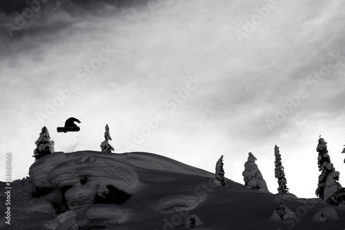 snowboarder jumping in Mica Creek, British Colombia, Canada (black and white) photo