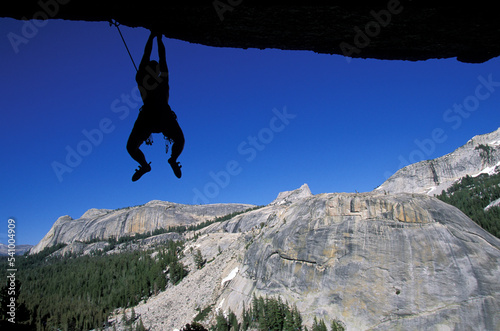 Rock climbing on a granite dome in Tuolumne Meadows, California. Tuolumne Meadows is a part of Yosemite National Park. photo