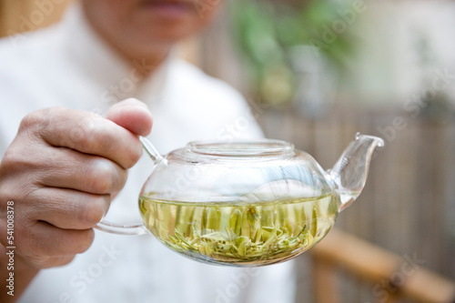 Minglou Chen, owner of the Minglou Tea House displays one of his freshly made teas during a traditional tea ceremony.