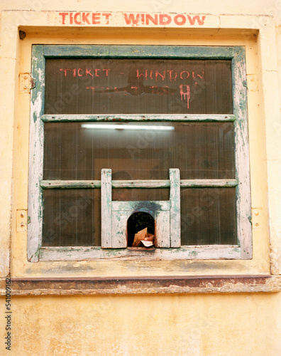 A man offers admission tickets to enter The Jantar Mantar which holds a collection of architectural astronomical instruments. Ja