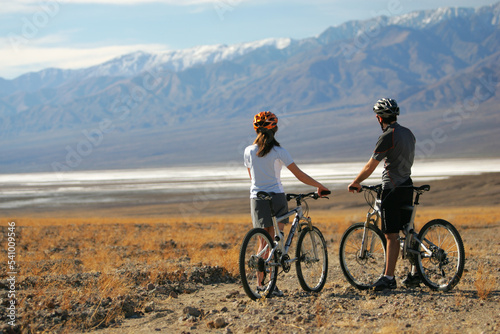 Two mountain bikers take advantage of perfect weather conditions for a ride in Death Valley National Park, California. photo
