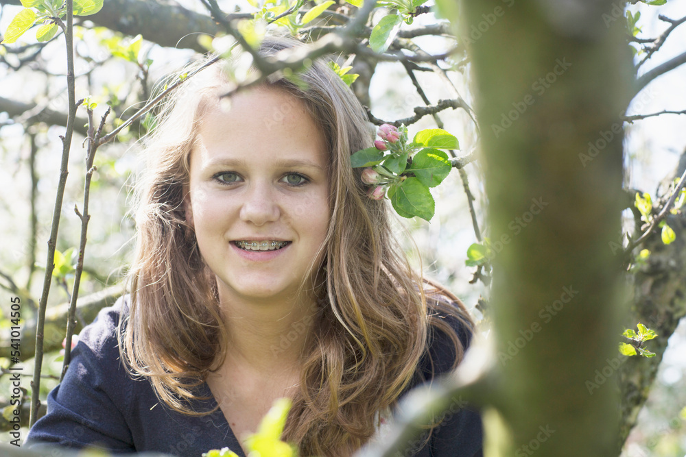 Portrait of teenage girl smiling, Freiburg im Breisgau, Baden-Württemberg, Germany Portrait of teenage girl smiling, Freiburg im Breisgau, Baden-Württemberg, Germany