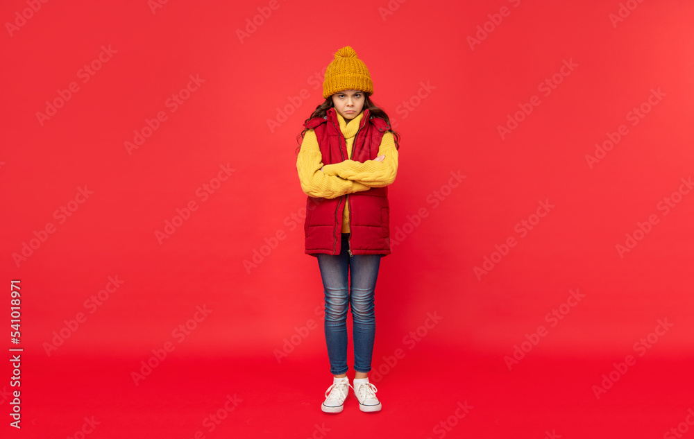 express emotion. winter fashion. unhappy kid with curly hair in hat. female fashion model.