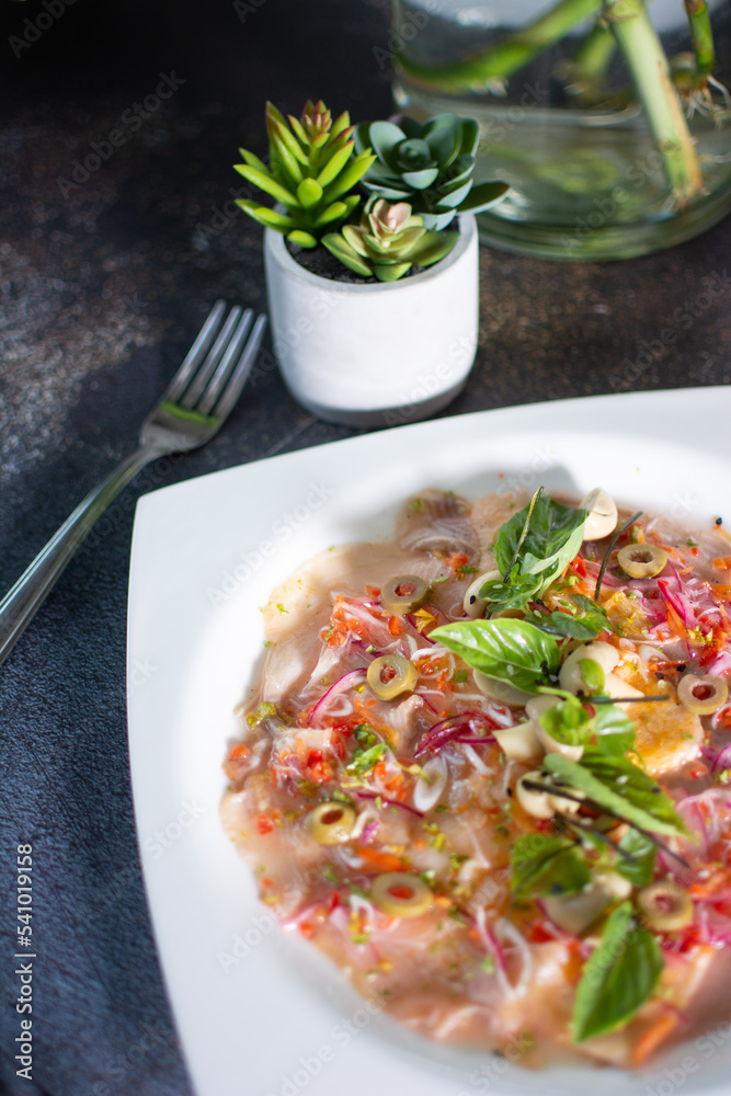 Fish carpaccio. Finely sliced fish. Tuna and needle fish. Garnished with Olive Oil and Capers Fish carpaccio. Finely sliced fish. Tuna and needle fish. Garnished with Olive Oil and Capers