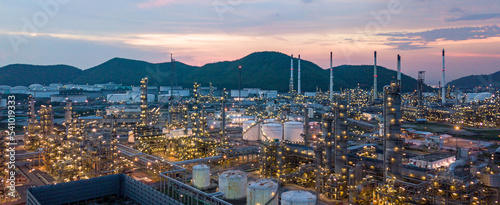 Aerial view oil storage tank and oil refinery factory plant at night form industry zone, Oil refinery and petrochemical plant factory at night, Business oil and gas industrial factory power and energy
