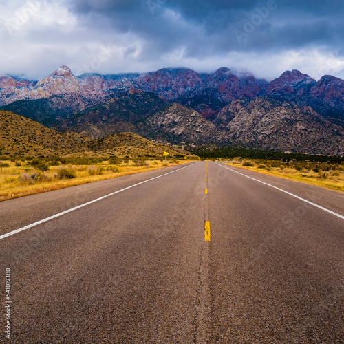 The road to the Sandia Mountains, a winter landscape with dramatic snowy clouds in Albuquerque, New Mexico, USA