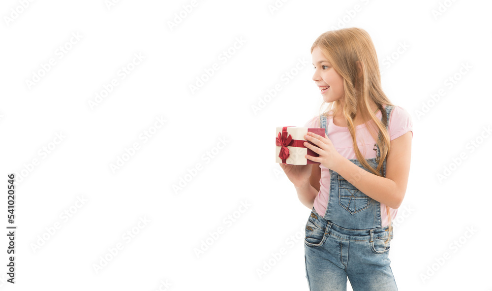 Happy teenager holding gift box isolated on white. Teenager smiling with birthday gift studio