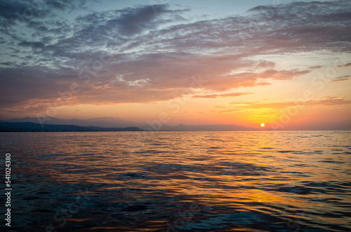 Greek summer sunset with sea water reflection © Piotr Wawrzyniuk
