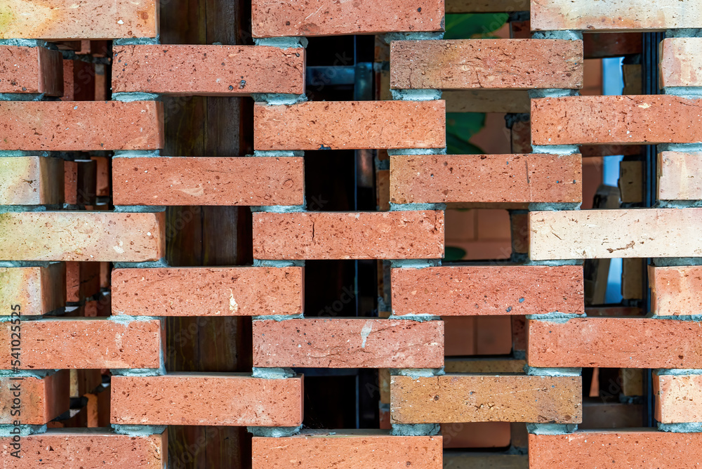 Close-up of decorative wall made of red bricks