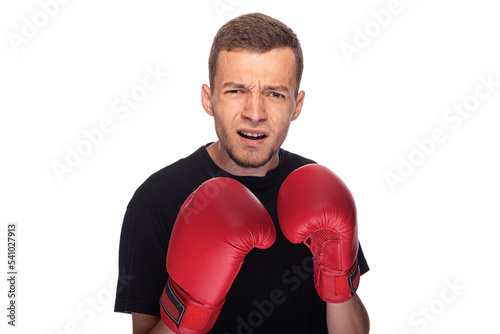 Cowardly funny young man in red boxing gloves.