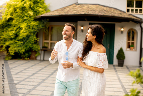 Young couple walking in the...