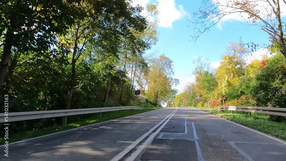 Beautiful nature of Poland autumn. The car is driving on the road Poland. Beautiful nature of Poland autumn. The car is driving on the road Poland.