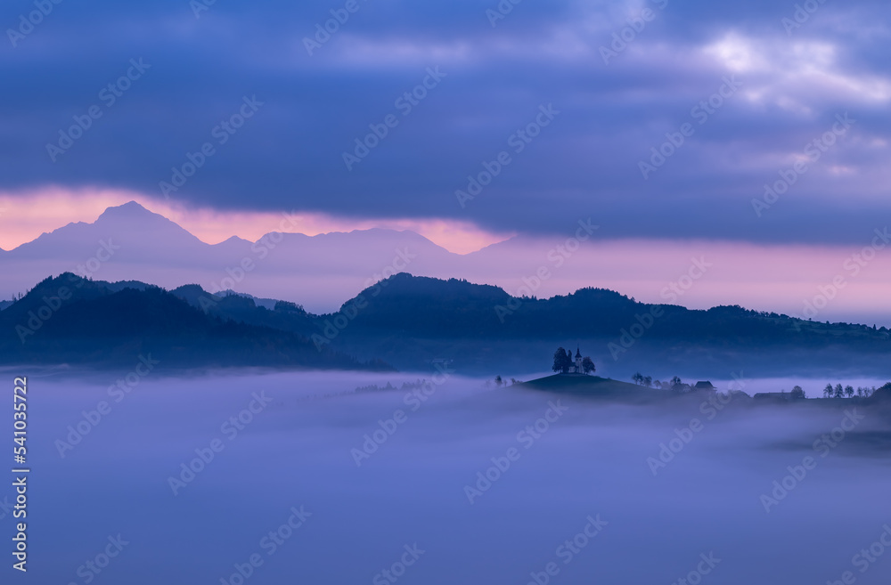 Cerkev Sveti Tomaž (St. Thomas Church) near Škofja Loka, Slovenia. Misty morning and sunrise