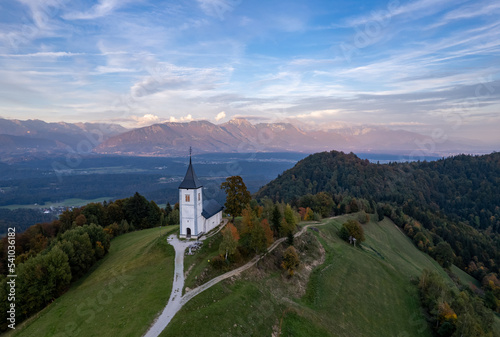 The Church of St. Primož and Felicijan, Jamnik, Slovenia, sunset drone photo