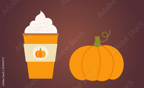 Pumpkin spice latte coffee in a cup and the pumpkin fruit. Autumn hot beverage.
