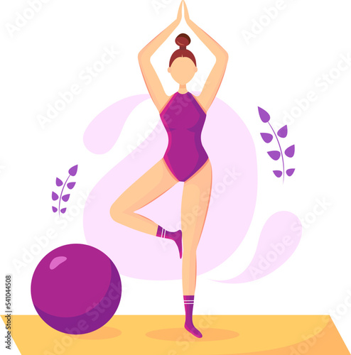 A girl does yoga in a purple bodysuit and stands on one leg on a mat, next to a training ball
