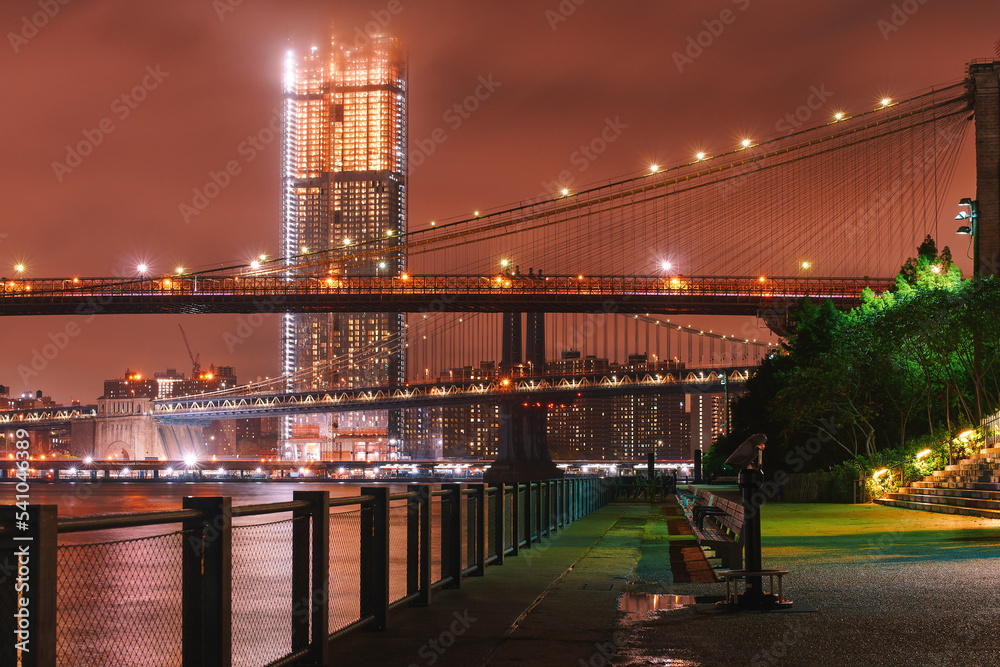 Night view of Brooklyn Bridge and Lower Manhattan skyline from Brooklyn Bridge Park in New York City