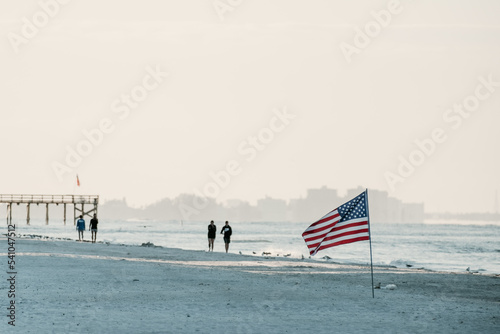 american flag on the beach