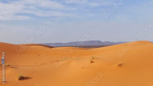 Amazing view of beautiful Sand dunes of the Sahara desert with a mountain in the background, Morocco