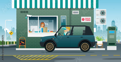 Husband and wife waiting to receive food at the Drive Thru counter.