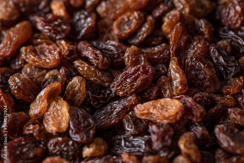 Pile of raisins scattered on table