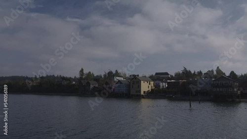 Clouds over houses at waterfront / Coupeville, Washington, United States photo
