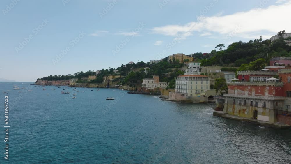 Forwards fly along luxury historic villas on sea coast in Mediterranean travel destination. Naples, Italy Forwards fly along luxury historic villas on sea coast in Mediterranean travel destination. Naples, Italy
