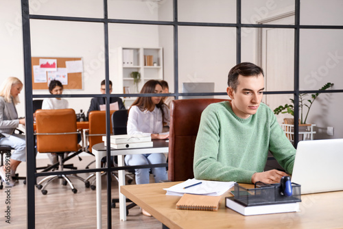 Young businessman working w...